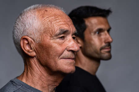 Descendants of the older generation of Europeans, concept in portrait. The old man and his son close up. High quality photoの写真素材