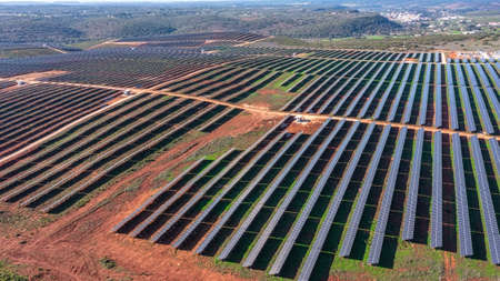 Aerial view of field with photovoltaic solar panels eco friendly renewable energy concept. High...