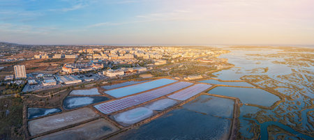 Aerial view of the Ria Formosa park with salt pans in the Portuguese city of Faro. Sunny day