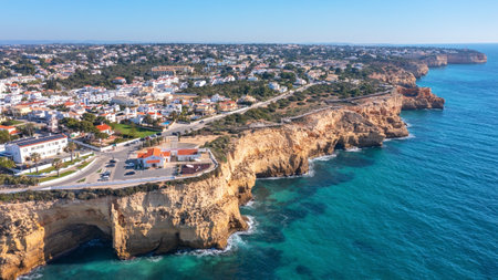 Aerial view of portuguese tourist village Carvoeiro Portugal Algarve in summer on a sunny day. wooden path over the rocksの写真素材
