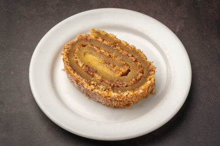 Traditional Portuguese cake roll Walnut pie and egg jam. With marble texture background. Torta de noz e doce de ovosの写真素材