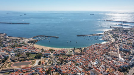 sines portugal. harbor dawn scene, early morning maritime activity with shining reflections at sunrise, aerial perspective capturing sunrise reflections and bustlingの写真素材