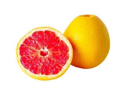 red grapefruit cut in half next to whole isolated on white backgroundの写真素材