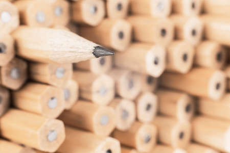 image of a sharp simple wooden pencil against other pencils, symbolizing a concept that stands out...