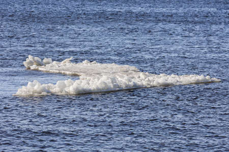 drifting piece of ice floating on the river