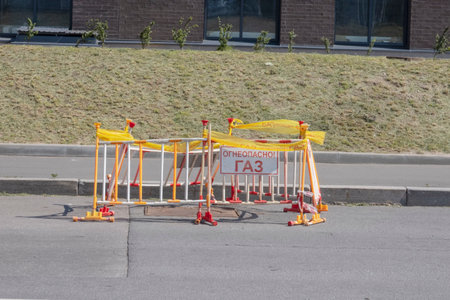 July 21, 2022 Russia, St. Petersburg, barriers installed on the road with a signal tape with the...