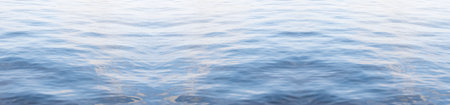 Widescreen background image: calm water surface with light ripples occupying the entire space