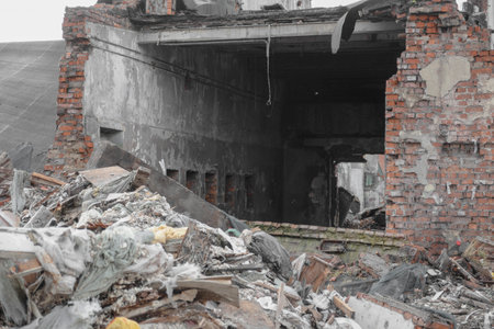 destroyed old red brick wall. passage in the wall, concept of ruins, war or natural disaster