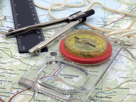 Kompass with tools on the mapの写真素材