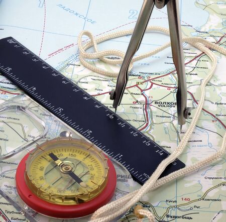 Kompass with tools on the mapの写真素材