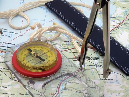 Kompass with tools on the mapの写真素材