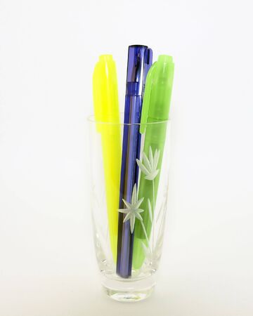 Color pen with glass on the white backgroundの写真素材