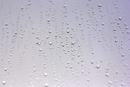 Drops of rain on the inclined window (glass). Shallow DOF.の写真素材
