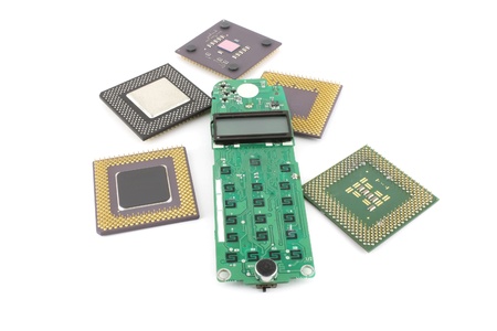 Circuit board (keypad) for cell phone with processors over white.