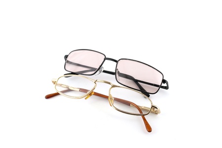 Two optical glasses over white