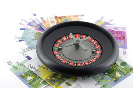 Roulette with money over white. Shallow DOF.の写真素材
