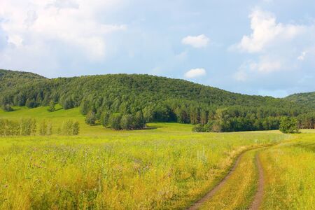 Roads to the mountains. Beautiful summer landscape. の写真素材