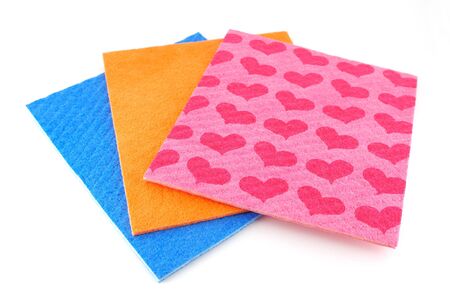 Orange, pink and blue napkins over whiteの写真素材