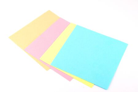 Four color reminder notes over white