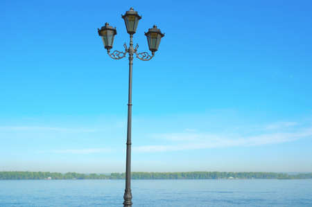 Street double lamp on the river and blue sky backgroundの写真素材