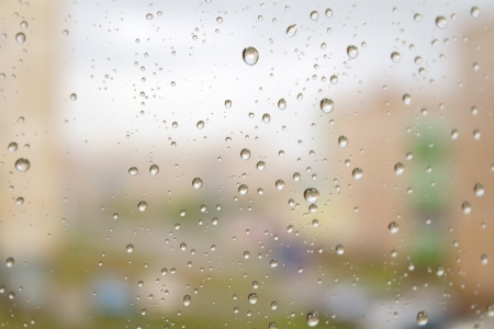 On a autumn raining day. Drops of water on the window. Shallow DOFの写真素材