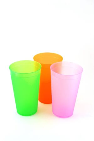 Green, orange and pink cupsの写真素材