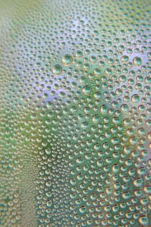 Abstract background. Drops of water on the crooked glass, shallow dofの写真素材