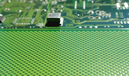 Old electronics circuit board for printer over white, shallow dof