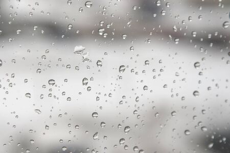 On a winter raining day. Drops of water on the window. Shallow DOFの写真素材
