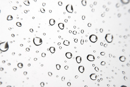 Abstract . Rain drops on the window.