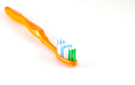 Orange toothbrush over neutralの写真素材