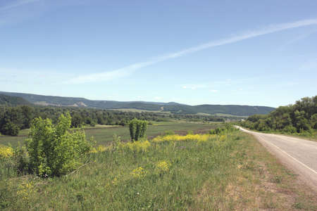 Summer landscape, road to the mountainsの写真素材