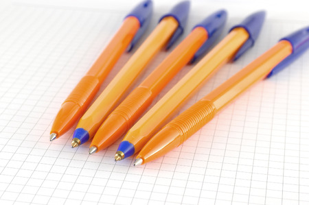 Five pen on the checked paper of notepad. Shallow DOFの写真素材