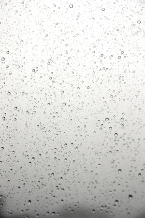 Drops of rain on the inclined window. Shallow DOFの写真素材