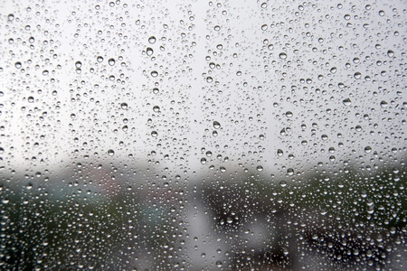 Drops of rain on the window (glass). Shallow DOF.の写真素材