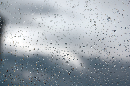 Drops of rain on the window (glass). Shallow DOF.の写真素材