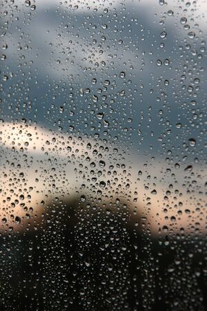 Drops of rain on the window (glass). Shallow DOF.の写真素材