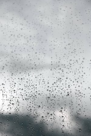 Drops of rain on the window (glass). Shallow DOF.の写真素材