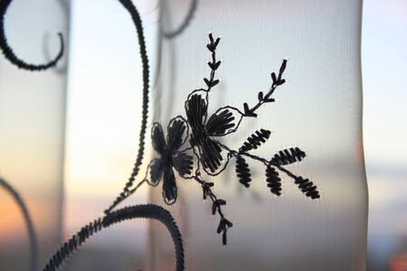Abstract background with tulle over sunset and sky, shallow dofの写真素材