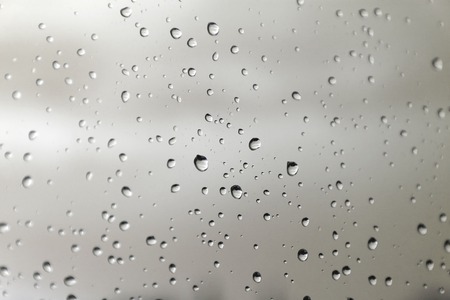 Drops of rain on the window (glass). Shallow DOF.の写真素材