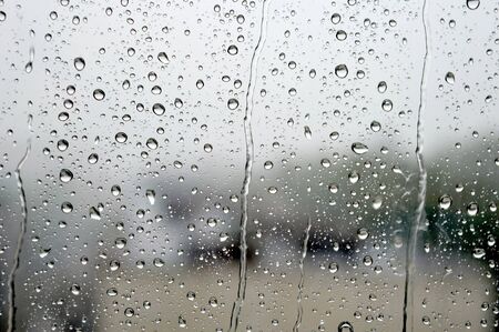 Drops of rain on the window, rainy day.