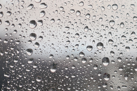 Drops of rain on the window, rainy day. Shallow DOFの写真素材