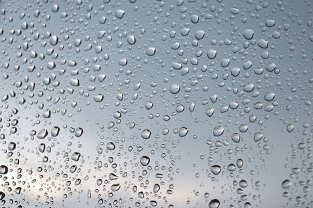 Drops of rain on the window, rainy day. Shallow DOFの写真素材