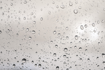 Drops of rain on the window, rainy day. Shallow DOFの写真素材