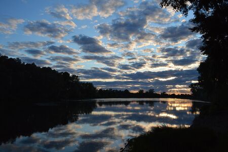beautiful evening landscape with riverの写真素材