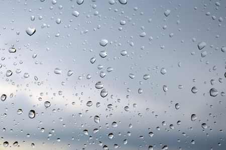 Drops of rain on the glass rainy day.の写真素材