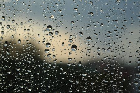 Drops of rain on the window, rainy day. Shallow DOFの写真素材