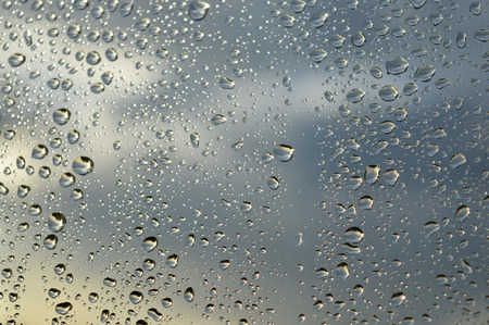 Drops of rain on the glass rainy day.の写真素材