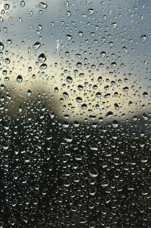 Drops of rain on the glass rainy day.の写真素材