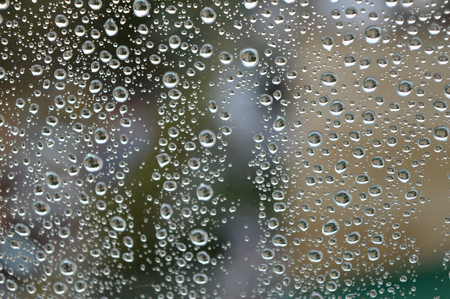Drops of rain on the glass rainy day.の写真素材